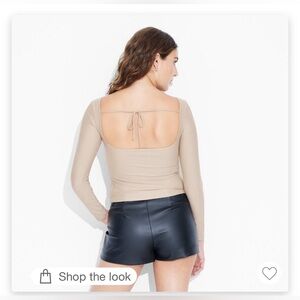 New with tags size women’s large long sleeved boat neck open back shirt.